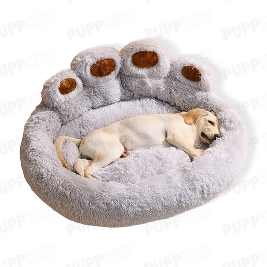 Cozy PlushPupp bed featuring paw design, with a dog sleeping peacefully.