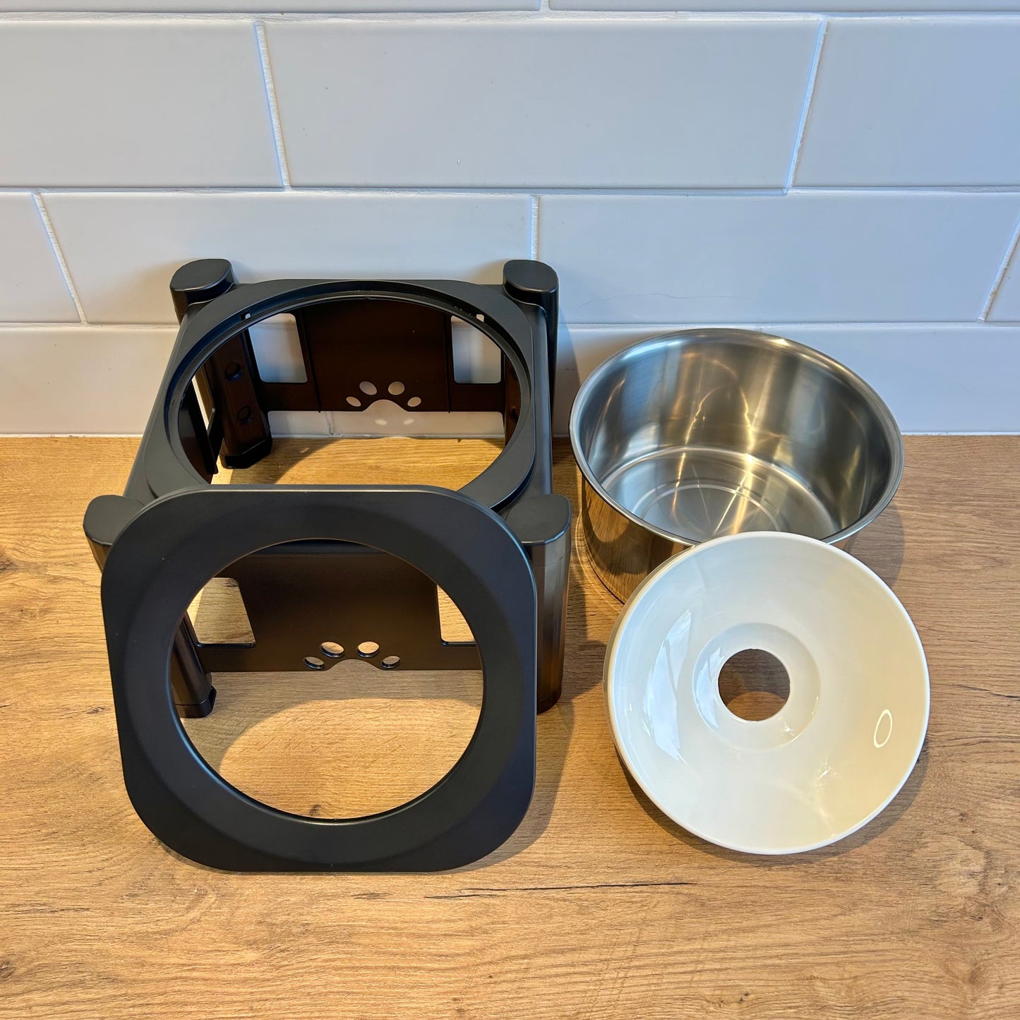 Components of Zero Splash Max dog bowl: holder, stainless steel bowl, and floating plate.